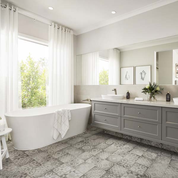 Clean modern white and grey bathroom with an unusual mosaic tiled floor.